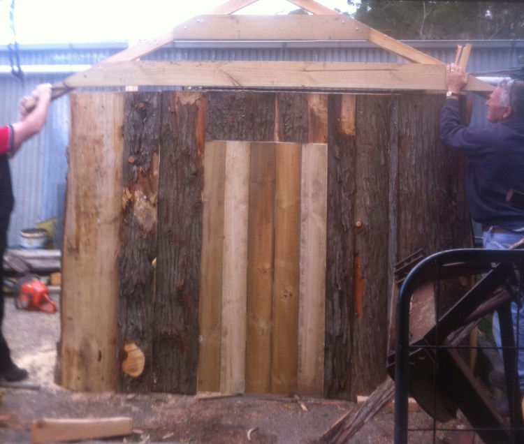 The roof starts going on.