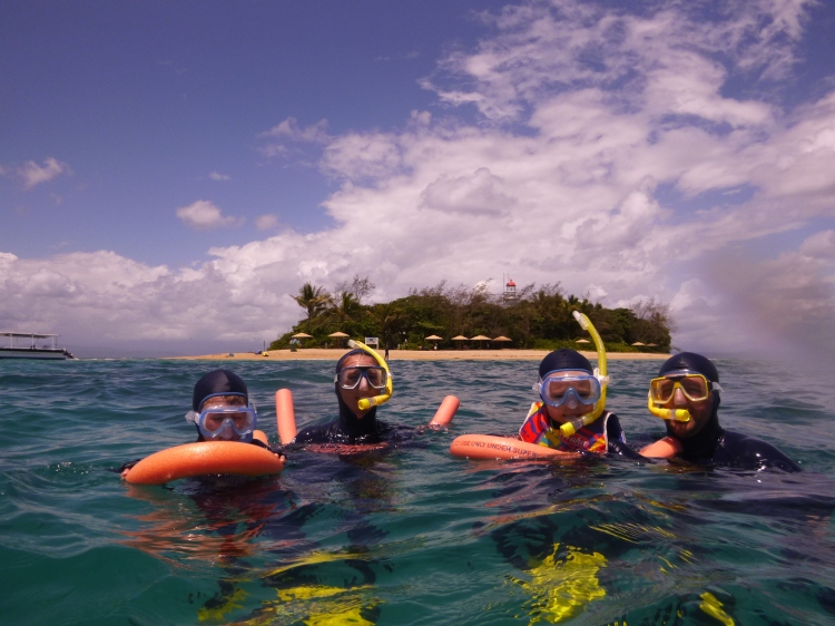 My family snorkelling at the Great Barrier Reef, Australia,