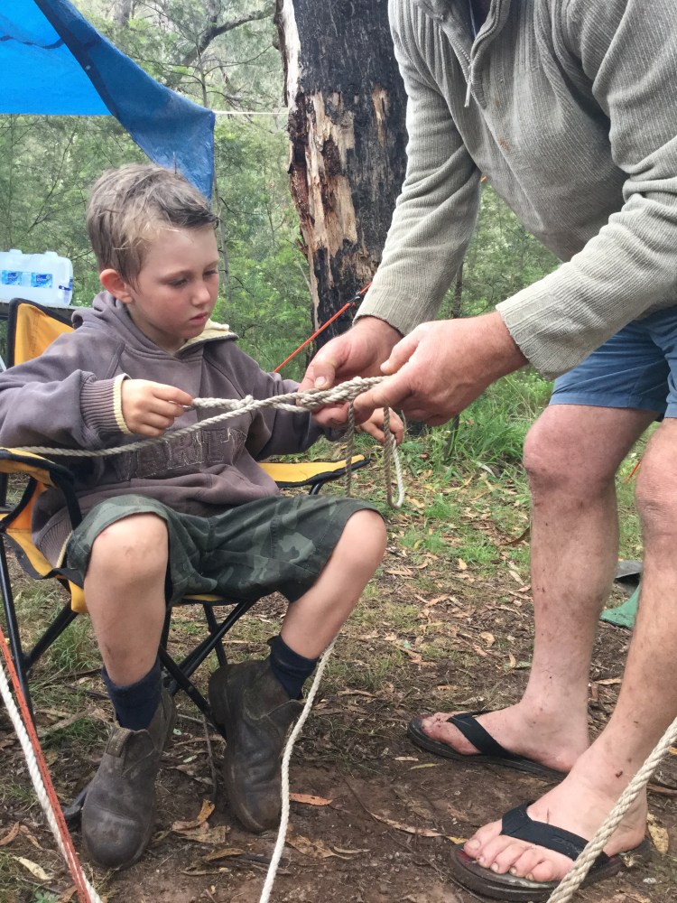 Poppy teaching Alby how to tie different types of knots.