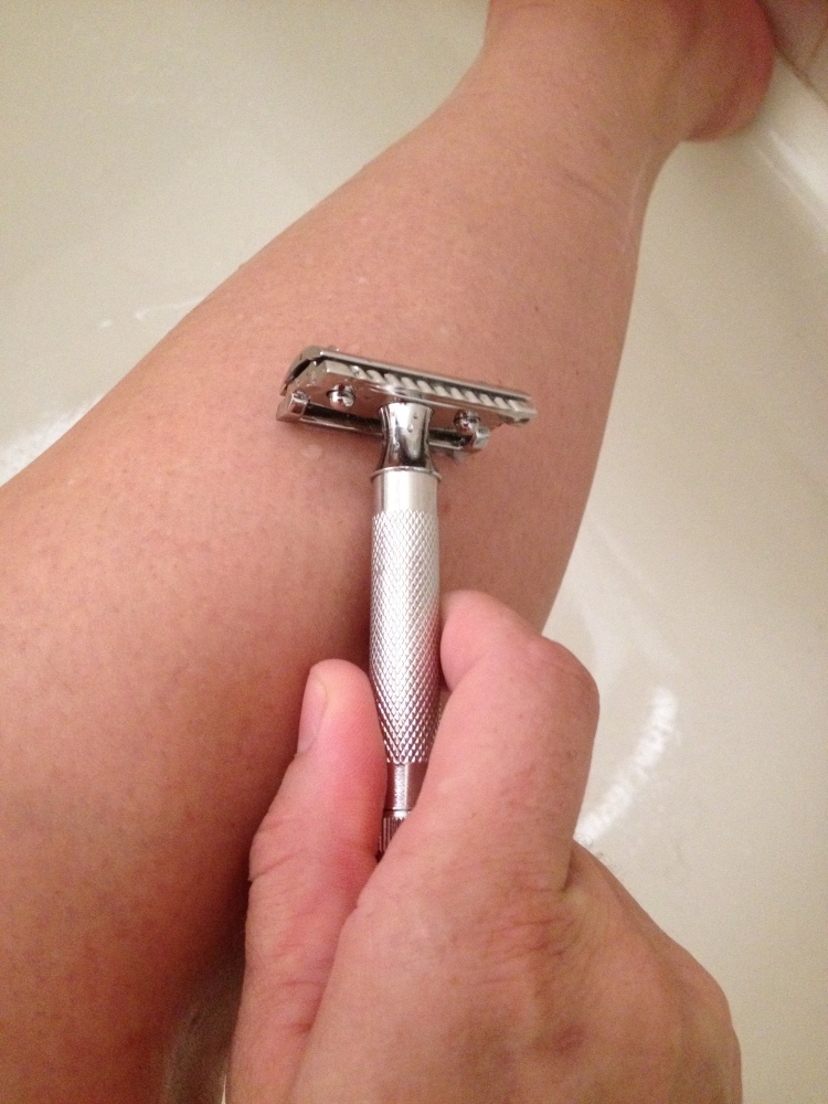 Shaving my legs over the bath tub to shave water.