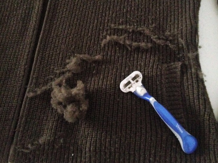 Using a disposable razor to de-pill clothing.